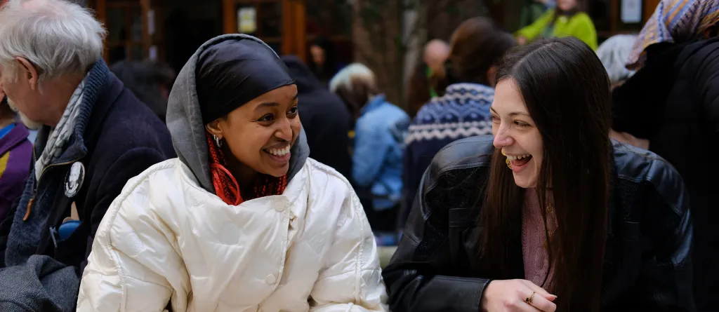 Two people laughing