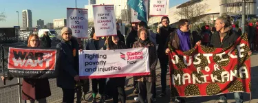 Campaigners at the UK– Africa Investment Summit in London 2020 with placards including "Say no to Empire 2.0", "Stop the new scramble for Africa", and "Justice for Marikana". 